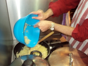 Preparing the filling for pereski - onions, boiled and mashed potato and spices.